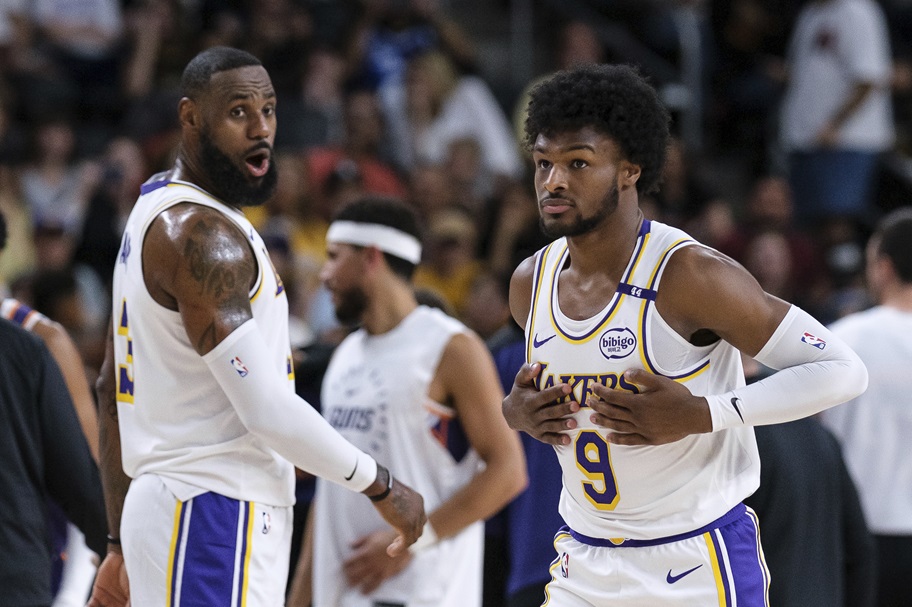 LeBron James looks at son Bronny as they play in an NBA together.