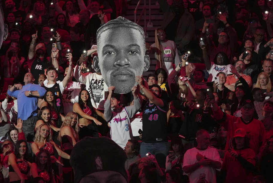 Miami Heat fans hold up picture of Jimmy Butler.