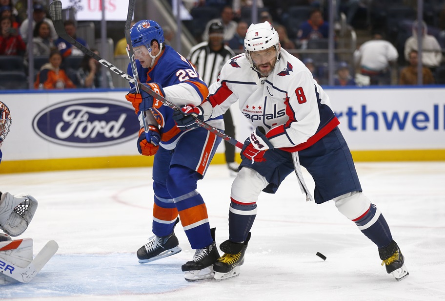 Washington's Alex Ovechkin battles for the puck in front of the net.